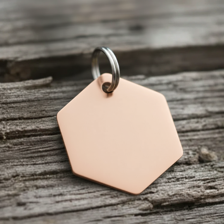 Hexagonal rose gold Tag on a wooden surface