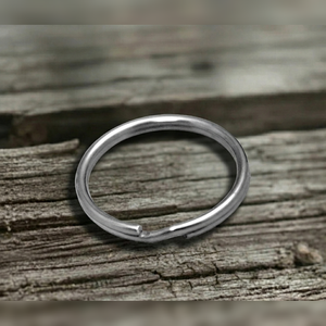 Stainless steel Split ring on a wooden surface